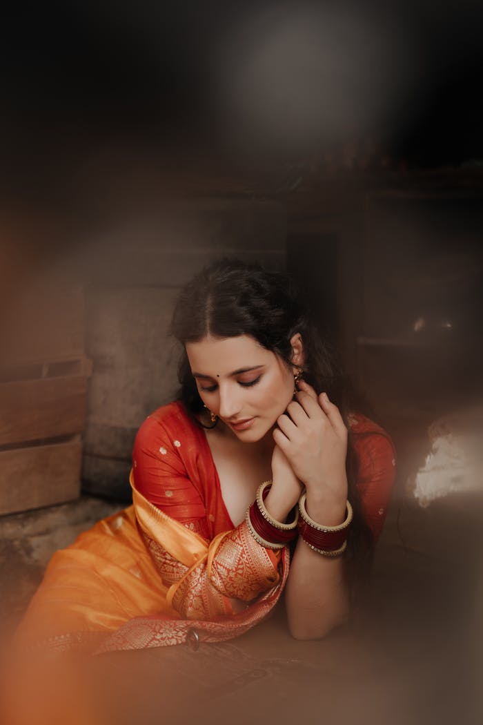 Portrait of a woman in a vibrant Indian saree, showcasing cultural elegance.